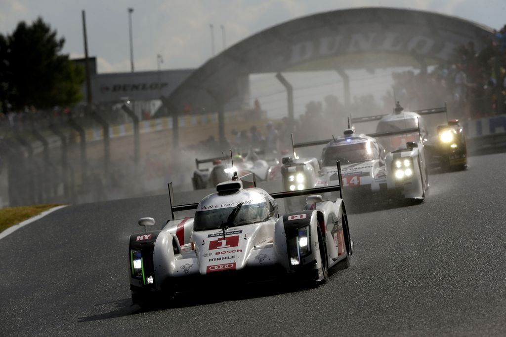 The Audi R18 e-tron quattro at the 2014 Le Mans 24 Hours. Lucas di Grassi, Tom Kristensen and Marc Gené finish second with the number 1 car behind their teammates Marcel Fässler, André Lotterer and Benoît Tréluyer. From the book "Audi at Le Mans," published in 2023 by Edition Audi Tradition.